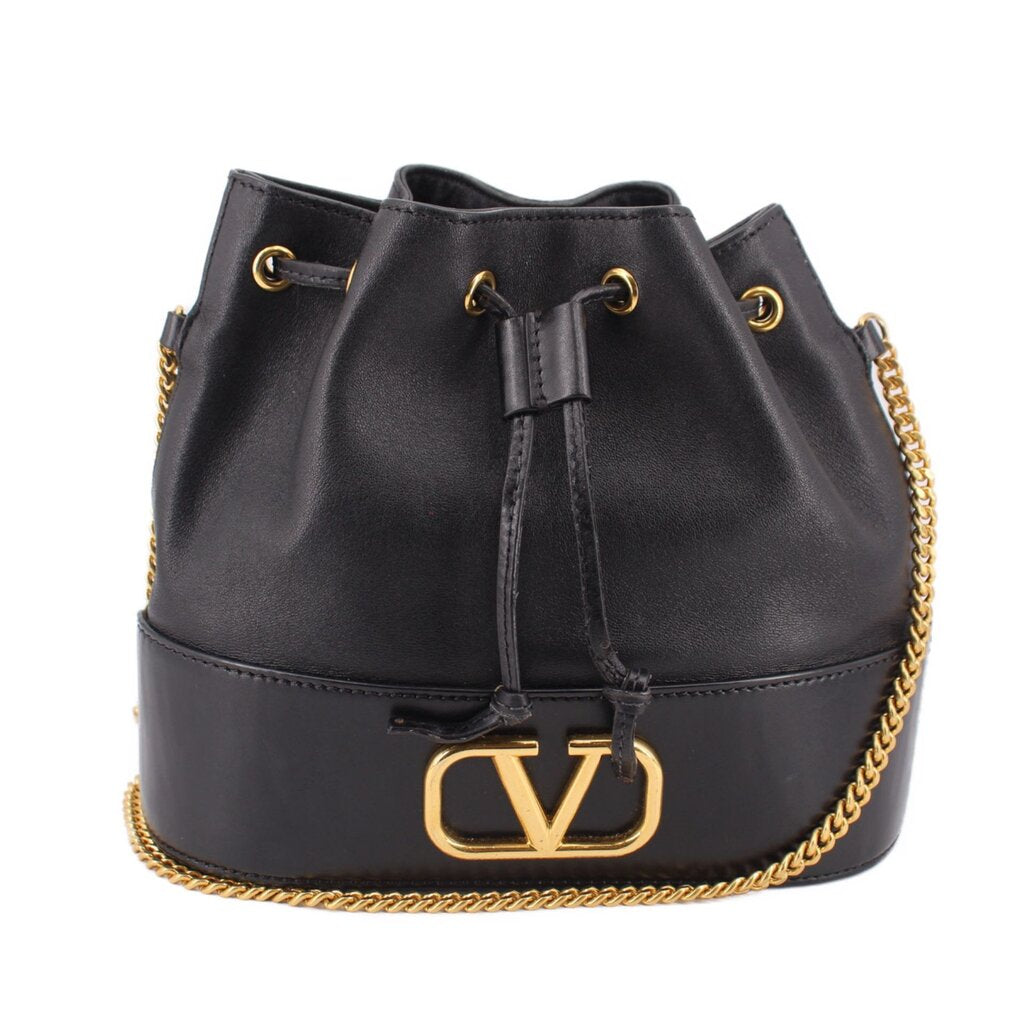 Black mini bucket crossbody bag with drawstring top, gold chain strap, V-logo clasp