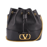 Black mini bucket crossbody bag with drawstring top, gold chain strap, V-logo clasp