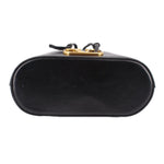 Black mini bucket crossbody bag back view with gold hardware and top handle straps