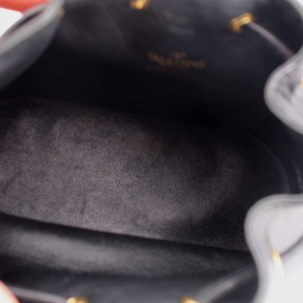 Black bucket crossbody interior lining with textured leather finish