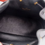 Black bucket crossbody interior lining with textured leather finish