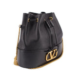 Black mini bucket crossbody bag with drawstring top, gold chain shoulder strap, V-logo