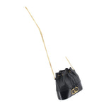 Black mini bucket crossbody bag with drawstring top and long gold chain strap