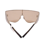 Shield sunglasses with brown tinted lenses and dark brown temples, low angle view