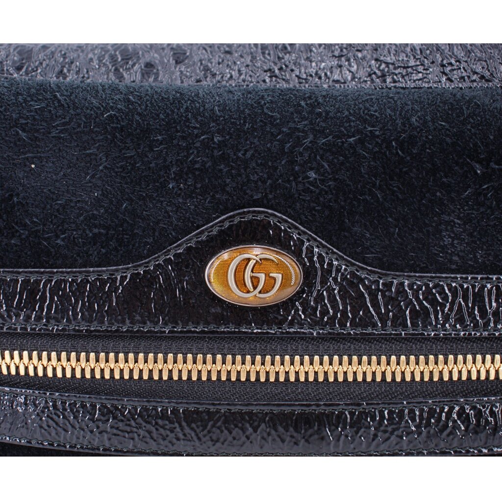 Black suede crossbody bag with GG emblem on shiny trim and gold zipper