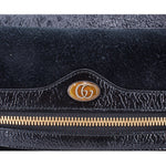 Black suede crossbody bag with GG emblem on shiny trim and gold zipper