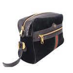 Black suede crossbody bag with gold zippers, leather strap, and green-red web stripe