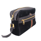 Black suede crossbody bag with gold zippers, leather strap, and green-red web stripe
