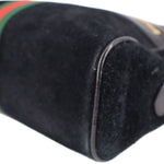 Black suede crossbody bag side seam and trim with edge of green-red stripe