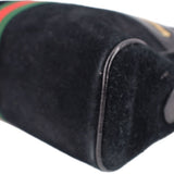 Black suede crossbody bag side seam and trim with edge of green-red stripe
