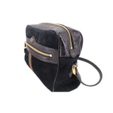 Black suede crossbody bag with front flap, gold zipper, and green-red web stripe
