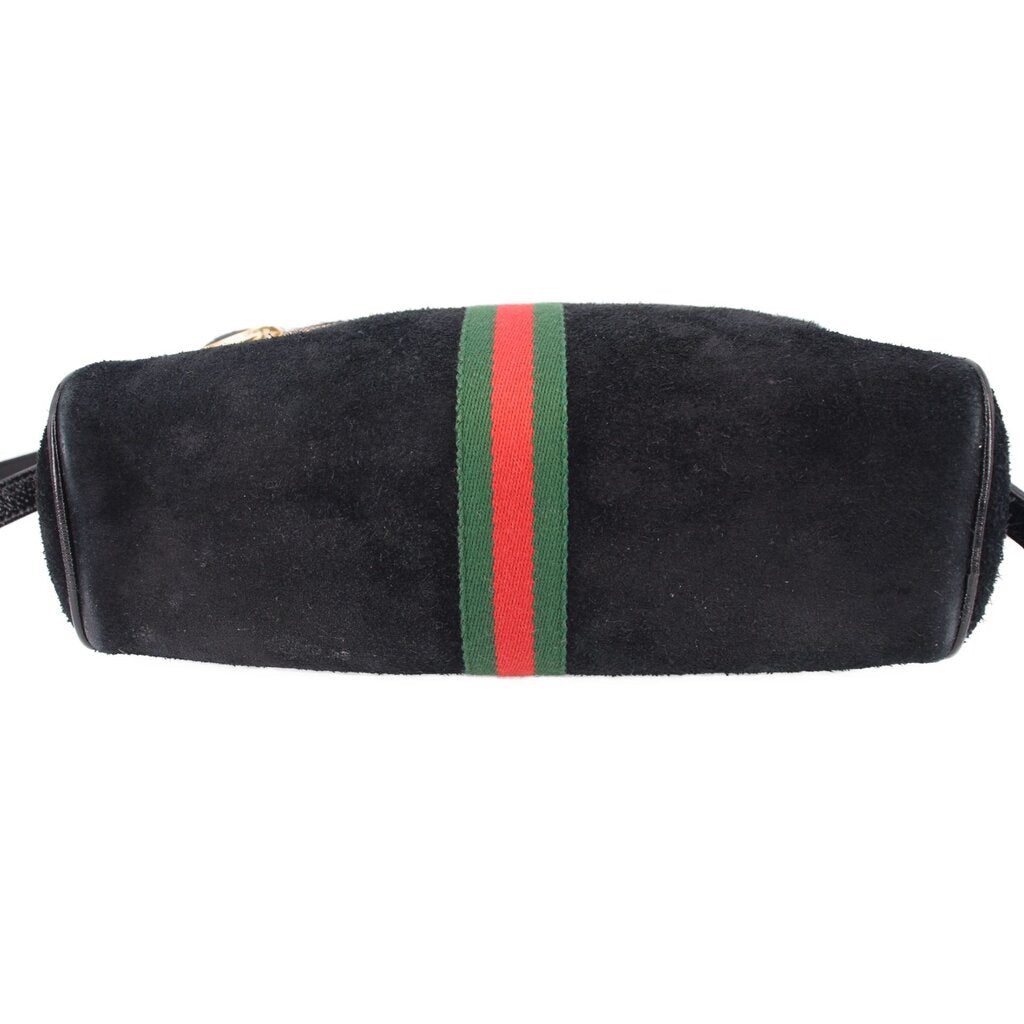 Black suede crossbody bag with centered green-red web stripe panel