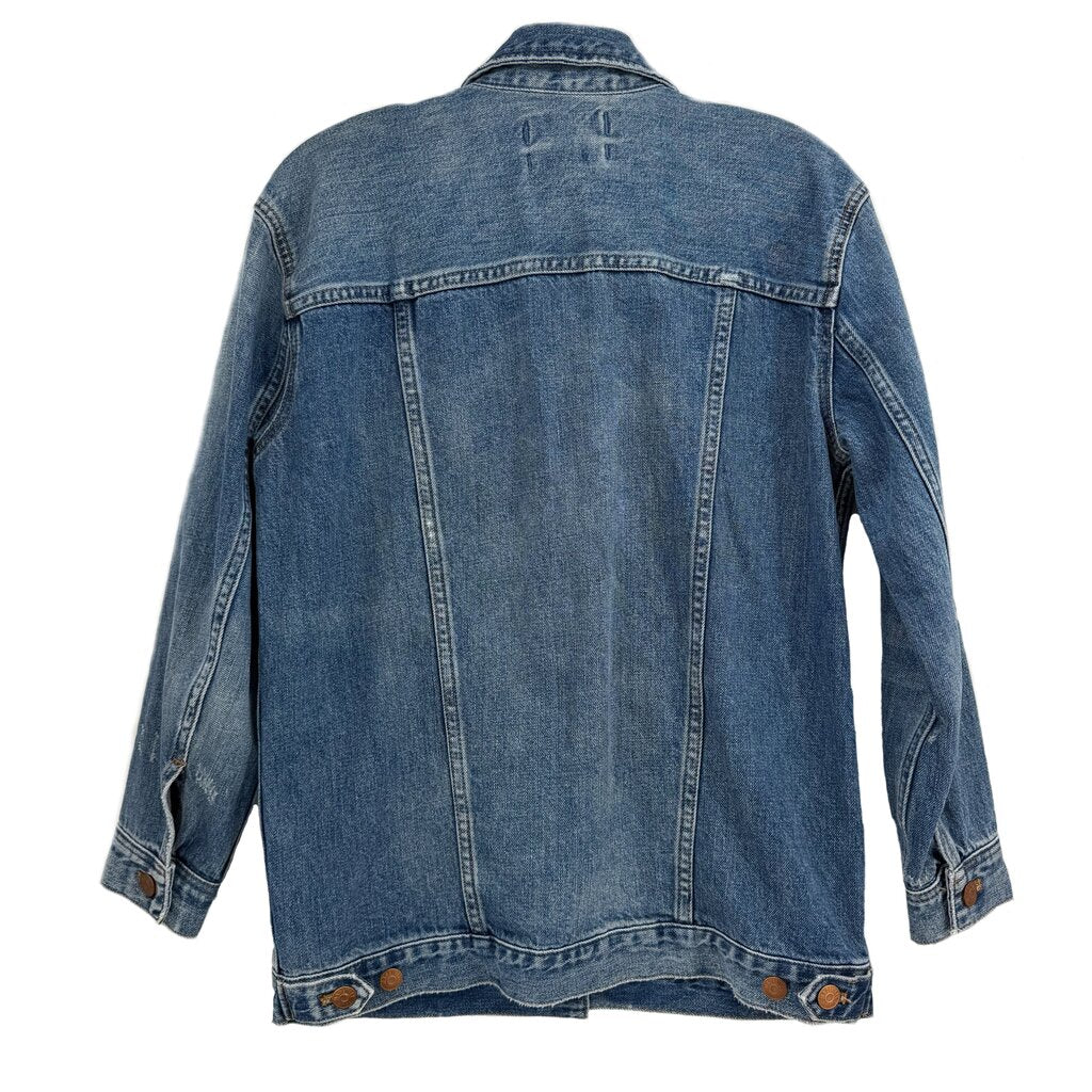 Blue denim jacket back view with yoke seams and buttoned hem