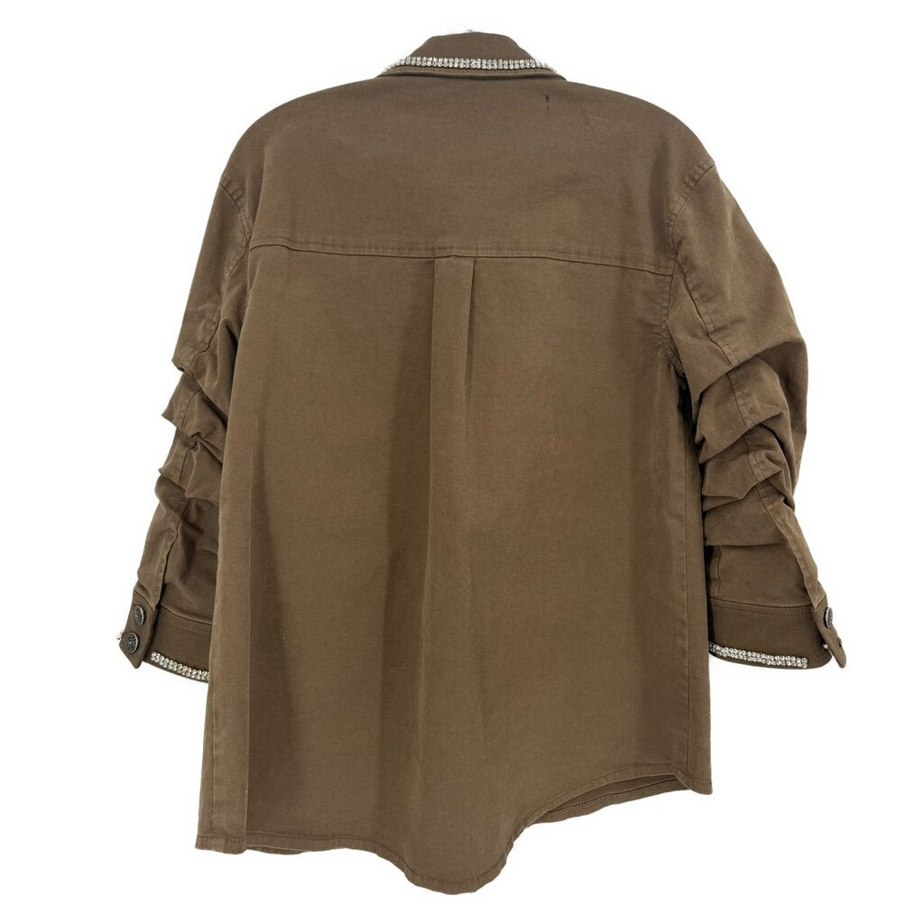 Back view of embellished olive-brown jacket with silver-trimmed cuffs and yoke