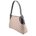 Large shoulder bag side view with GG monogram canvas and dark leather strap with buckle