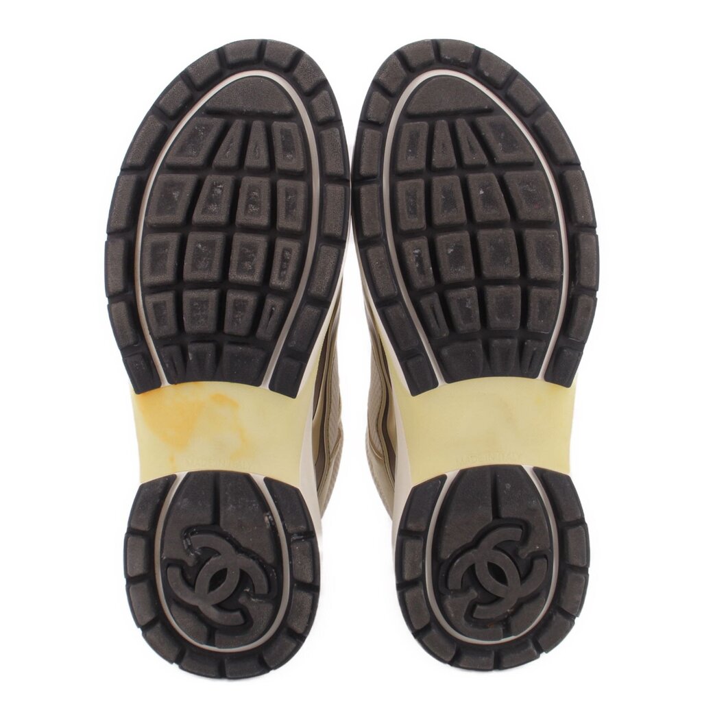 CHANEL tennis sneaker outsoles, textured black tread with embossed logo