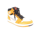 High-top sneakers with light yellow leather, black collar, white swoosh, orange stitching