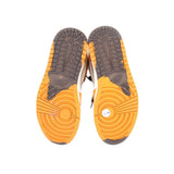 Outsoles of high-top sneakers with gray tread and orange rubber, white midfoot panels