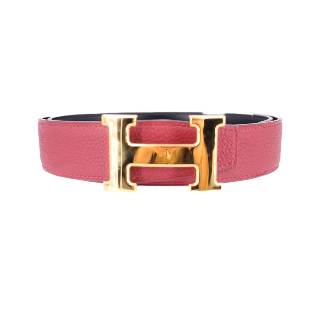 Leather belt with red strap, black lining, and gold-tone buckle