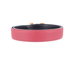 Red leather belt with black interior lining and gold-tone buckle tabs
