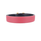 Red leather belt with black interior lining and gold-tone buckle tabs
