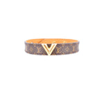 Monogram V leather bracelet with brown pattern and gold V clasp, orange lining