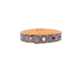 Monogram V leather bracelet with adjustable clasp and brown pattern, orange lining