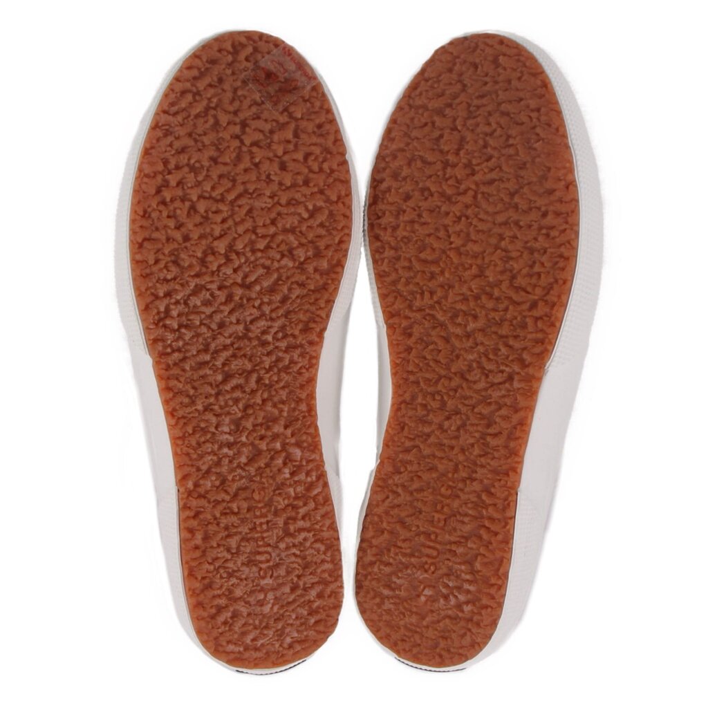Brown textured rubber outsoles for white canvas low-top sneakers.