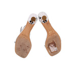 Silver sandal footbeds and heel undersides with embossed BIRMAN branding.