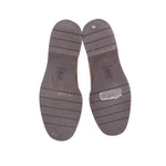 Taupe suede loafer outsoles with tread grooves and brand imprint