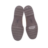Taupe suede loafer outsoles with tread grooves and brand imprint