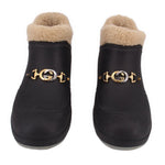 Pair of GUCCI black fur-lined booties with gold-tone GG buckle