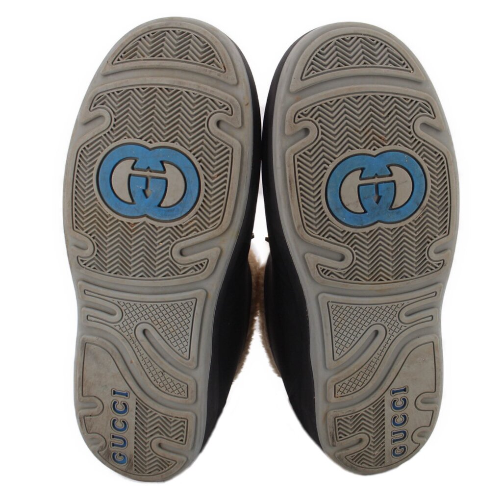 GUCCI booties outsoles with patterned tread and blue GG logo