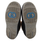GUCCI booties outsoles with patterned tread and blue GG logo