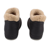 GUCCI black fur-lined booties from back with tan shearling trim