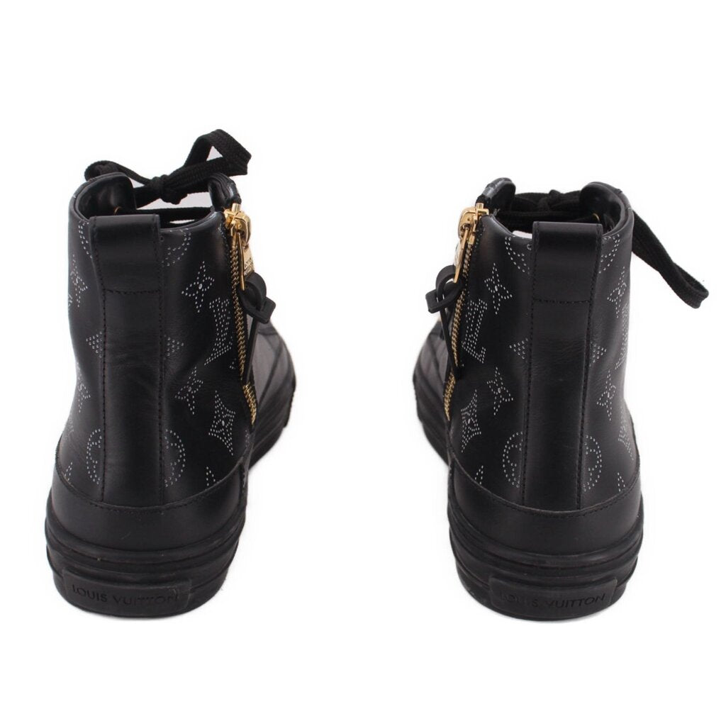 LOUIS VUITTON black high-top sneakers, heel view with zipper pull and gold accents