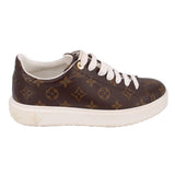 Brown monogram lace-up sneakers with white laces, thick rubber platform sole.
