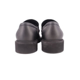 Back view of black leather loafers with low stacked heel