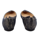 Back view of metallic navy pointed-toe flats with flat heel and stitched edging