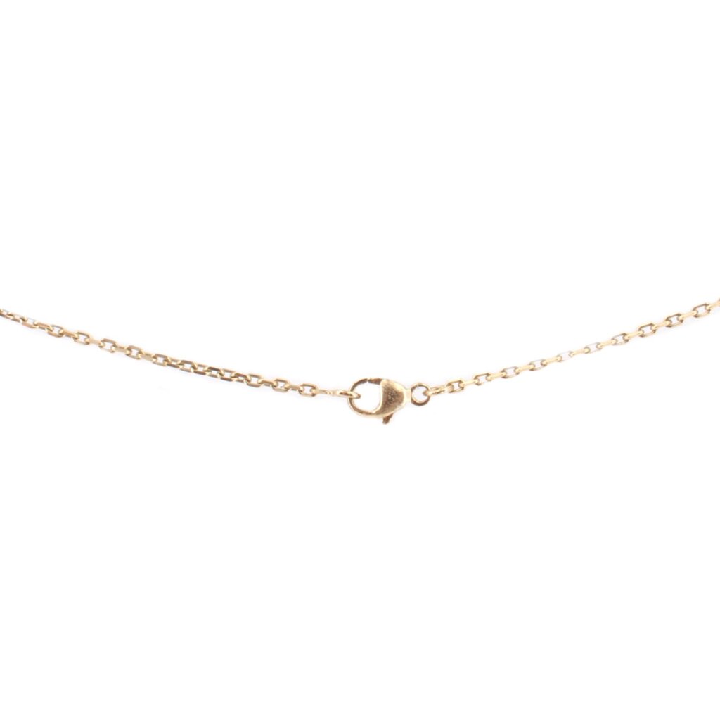 Gold-tone necklace with small dark lock-shaped link at center on fine chain