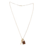 Gold-tone padlock necklace with brown lock charm and key pendant on thin chain