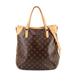 Monogram tote crossbody bag with tan handles and dark brown body, leather trim