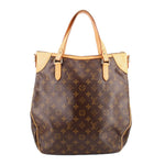 Monogram tote crossbody bag front view with tan handles and dark brown patterned leather
