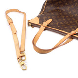 Monogram crossbody bag with tan leather strap, gold rings, and zip closure