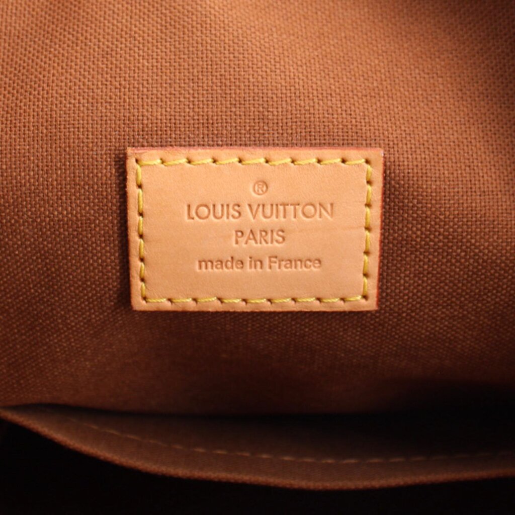 Louis Vuitton Paris made in France leather patch with tan stitching on brown lining