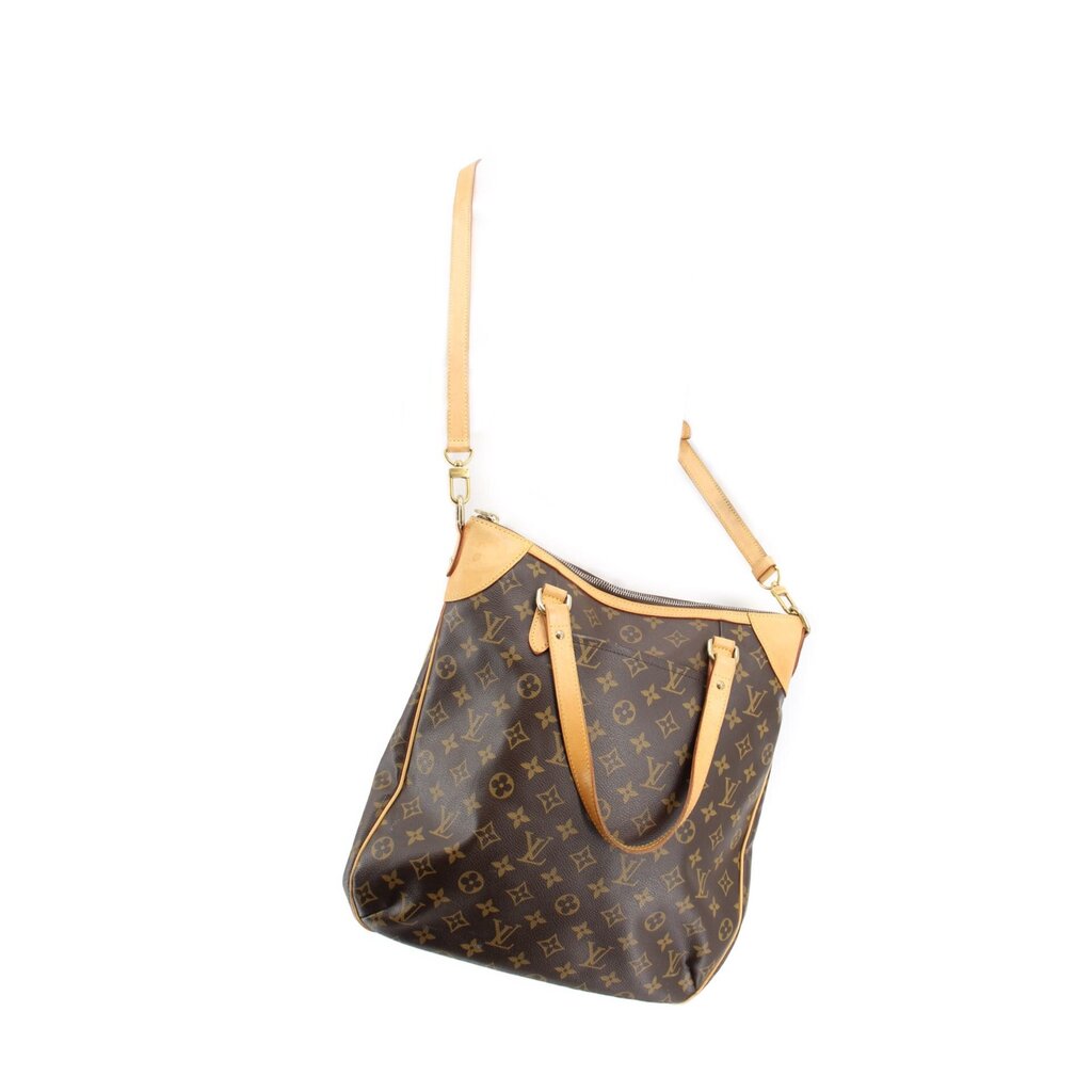 Monogram shoulder bag with adjustable tan strap and gold-tone hardware, front pocket