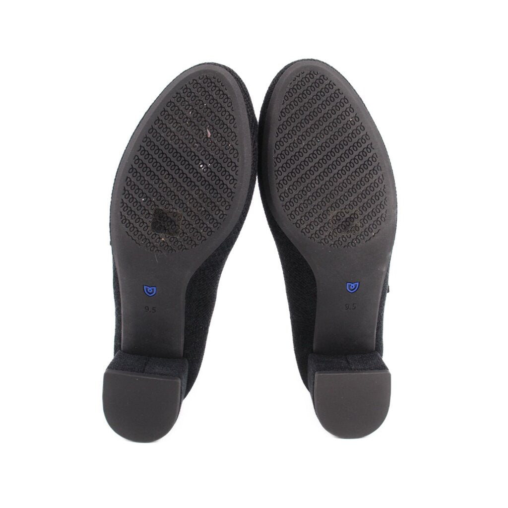 Bottom view of black Mary Jane heels with textured rubber sole