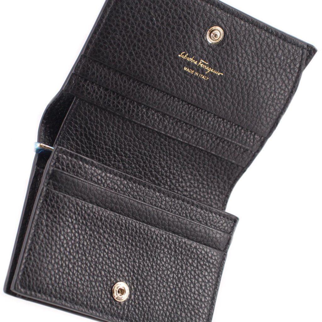 Black leather wallet interior with card slots and snap-button hardware