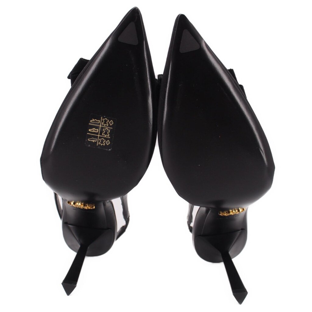 Prada black slingback heels close-up with heel logo and pointed sole