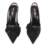 Pair of Prada black slingback heels with bow across the front